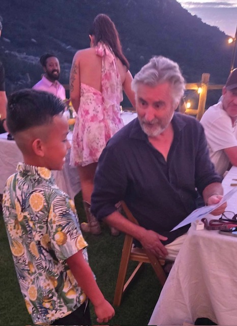 a man talking to a boy in an event